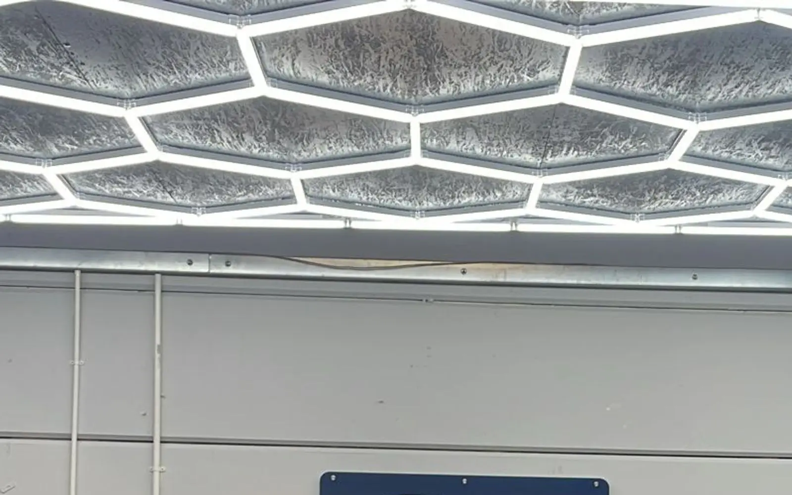 The lit workshop ceiling at The Prius Centre
